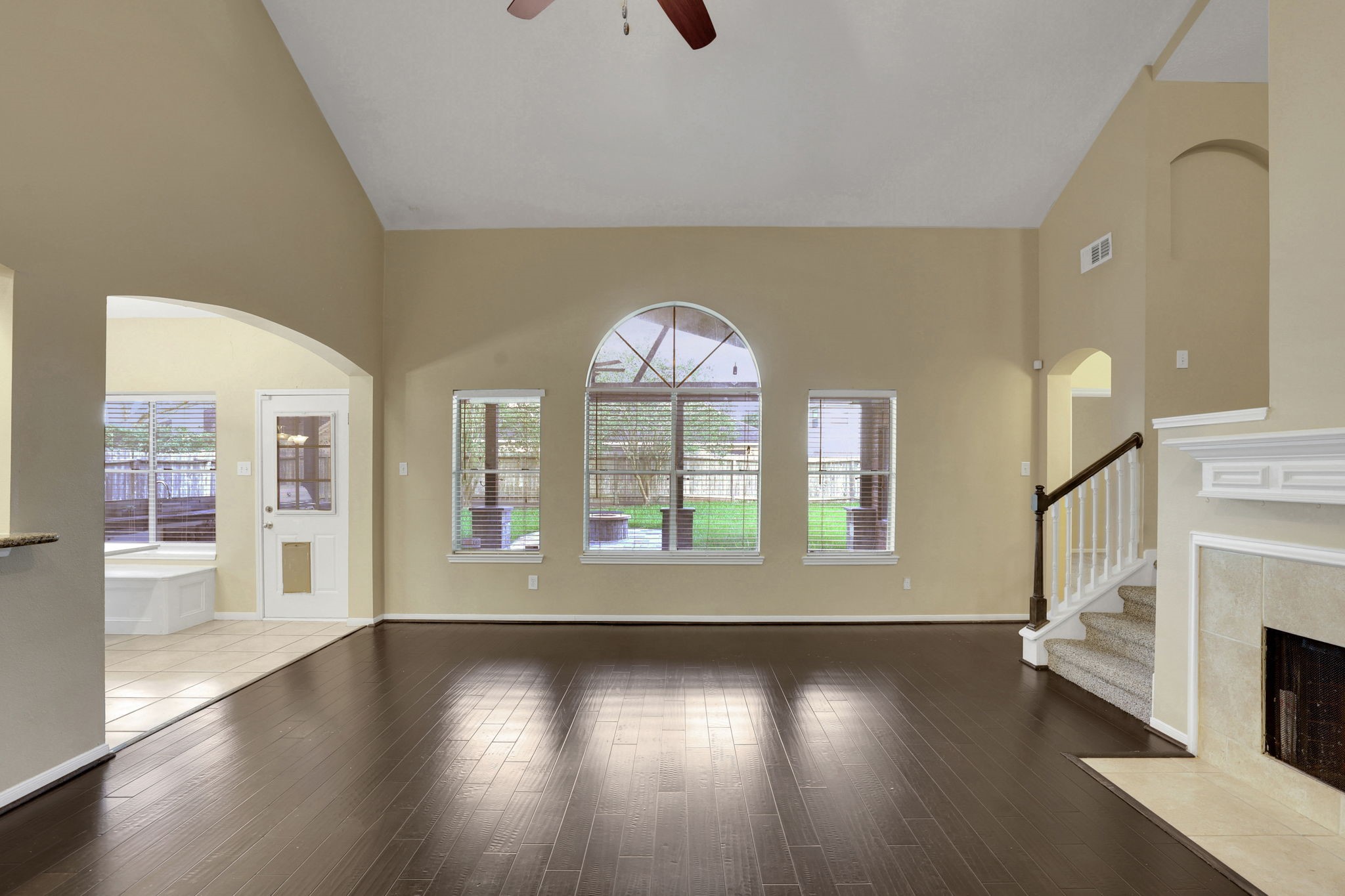 23207 Olive Ridge Court Katy, TX 77494 - Photo 14 of 46 an empty room with wooden floor and windows