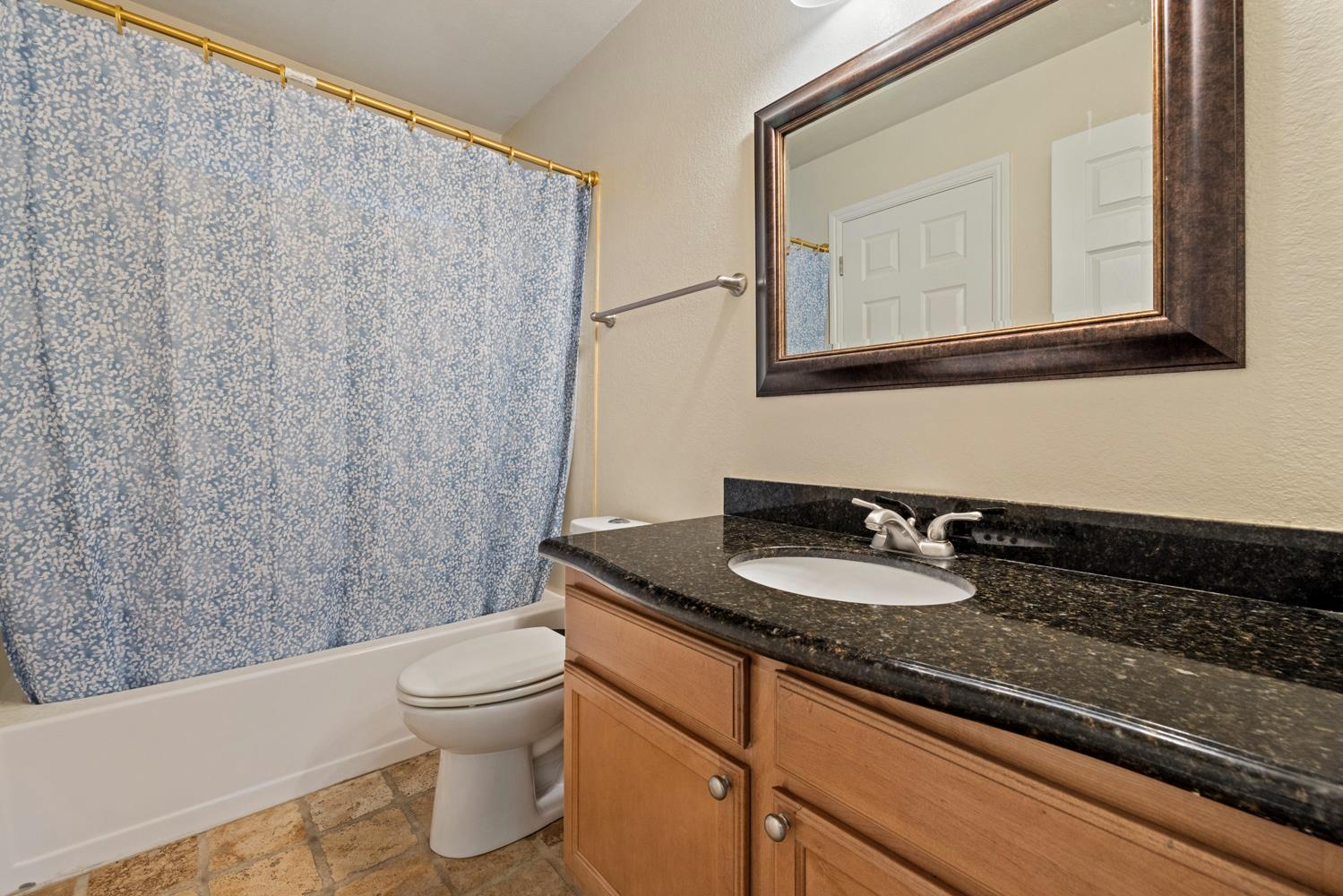 3901 Dale Road, Unit A Modesto, CA 95356 - Photo 15 of 23 a bathroom with a granite countertop sink and a mirror