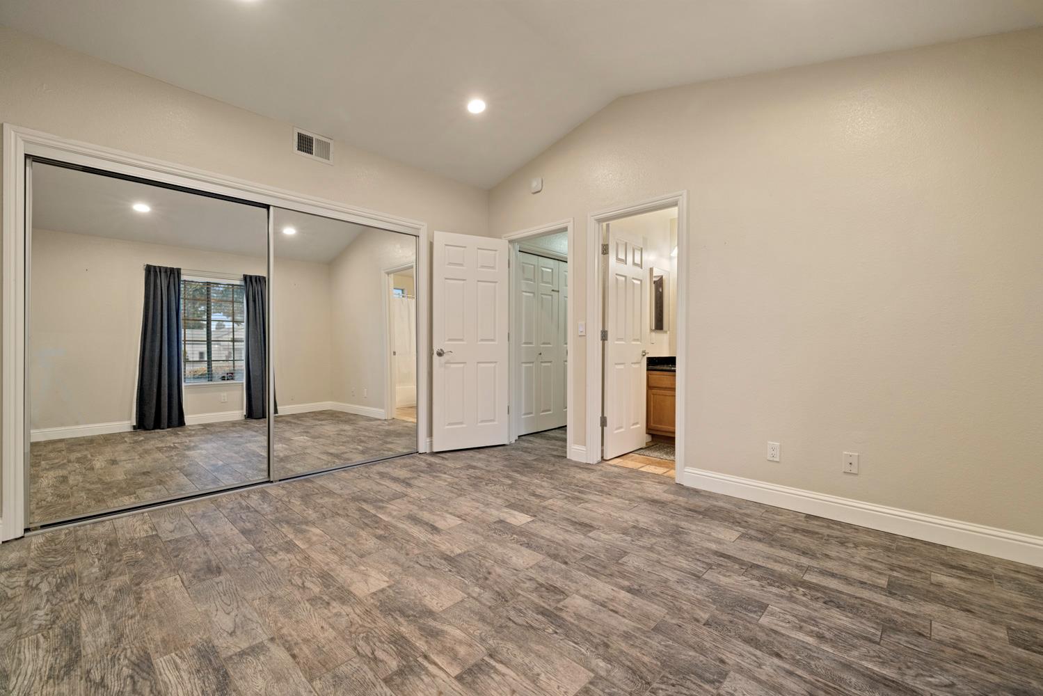 3901 Dale Road, Unit A Modesto, CA 95356 - Photo 20 of 23 an empty room with closet and wooden floor