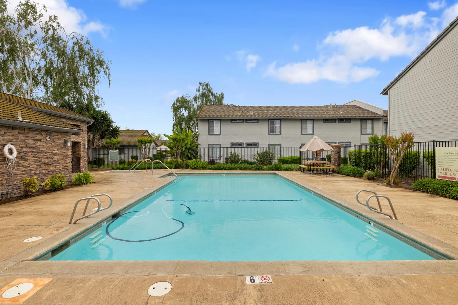 3901 Dale Road, Unit A Modesto, CA 95356 - Photo 22 of 23 a view of a house with swimming pool