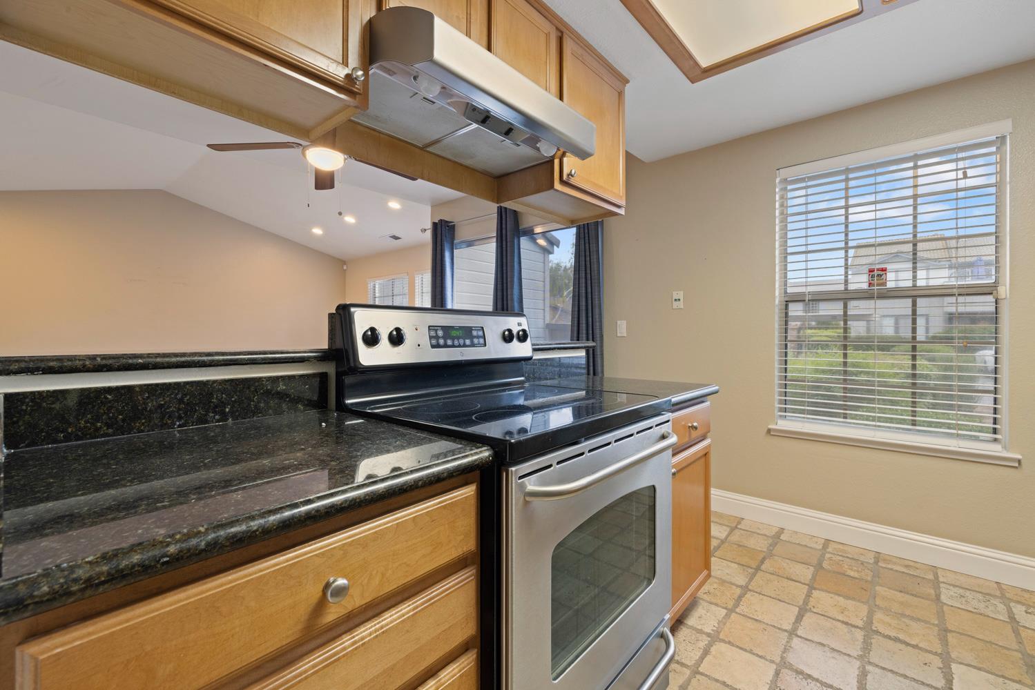 3901 Dale Road, Unit A Modesto, CA 95356 - Photo 4 of 23 a stove top oven sitting inside of a kitchen