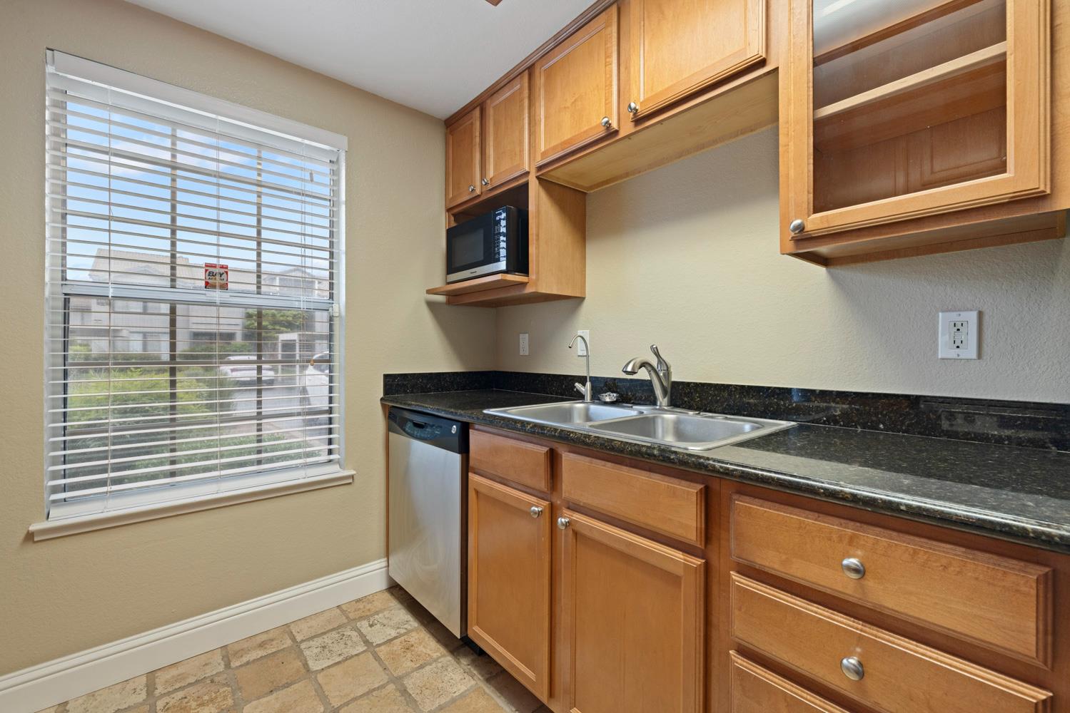 3901 Dale Road, Unit A Modesto, CA 95356 - Photo 5 of 23 a kitchen with a sink and cabinets