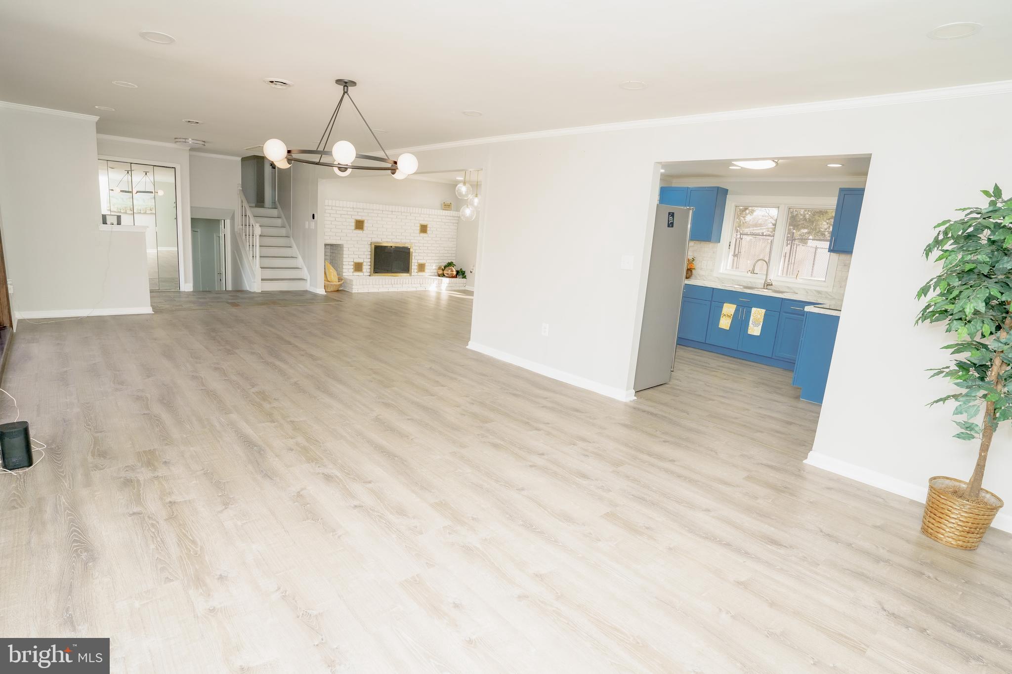 907 Reece Road Severn, MD 21144 - Photo 17 of 56 a view of a living room and kitchen with furniture