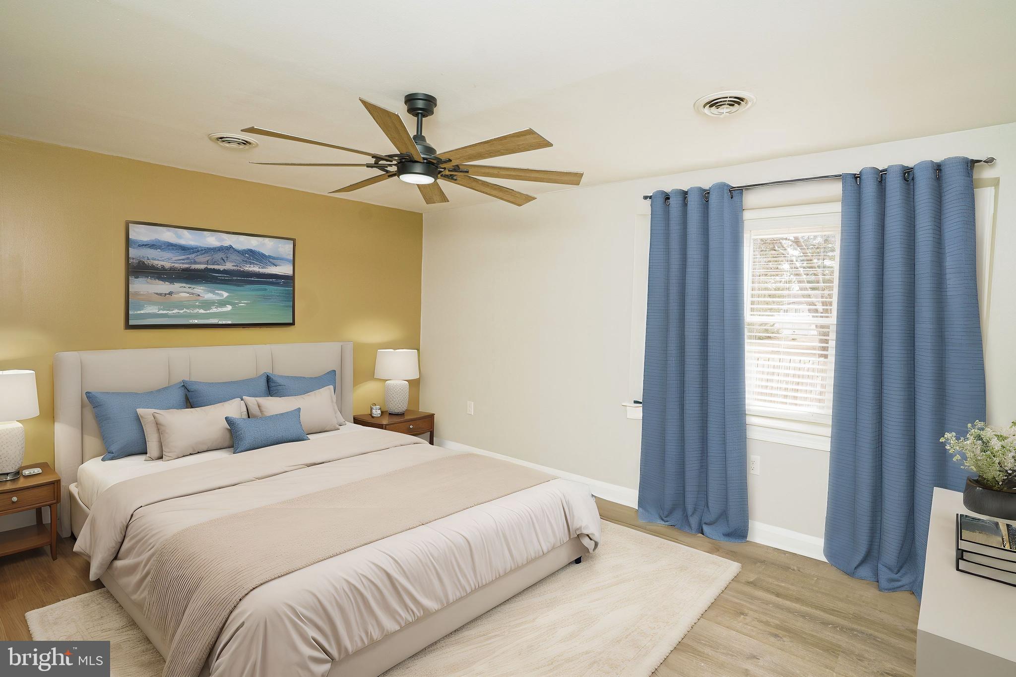 907 Reece Road Severn, MD 21144 - Photo 22 of 56 a bedroom with a large bed and a window