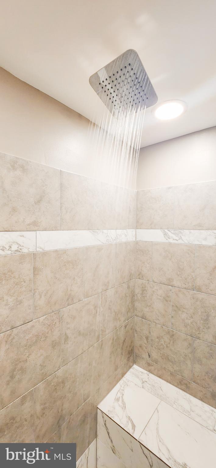 907 Reece Road Severn, MD 21144 - Photo 26 of 56 a bathroom with a shower