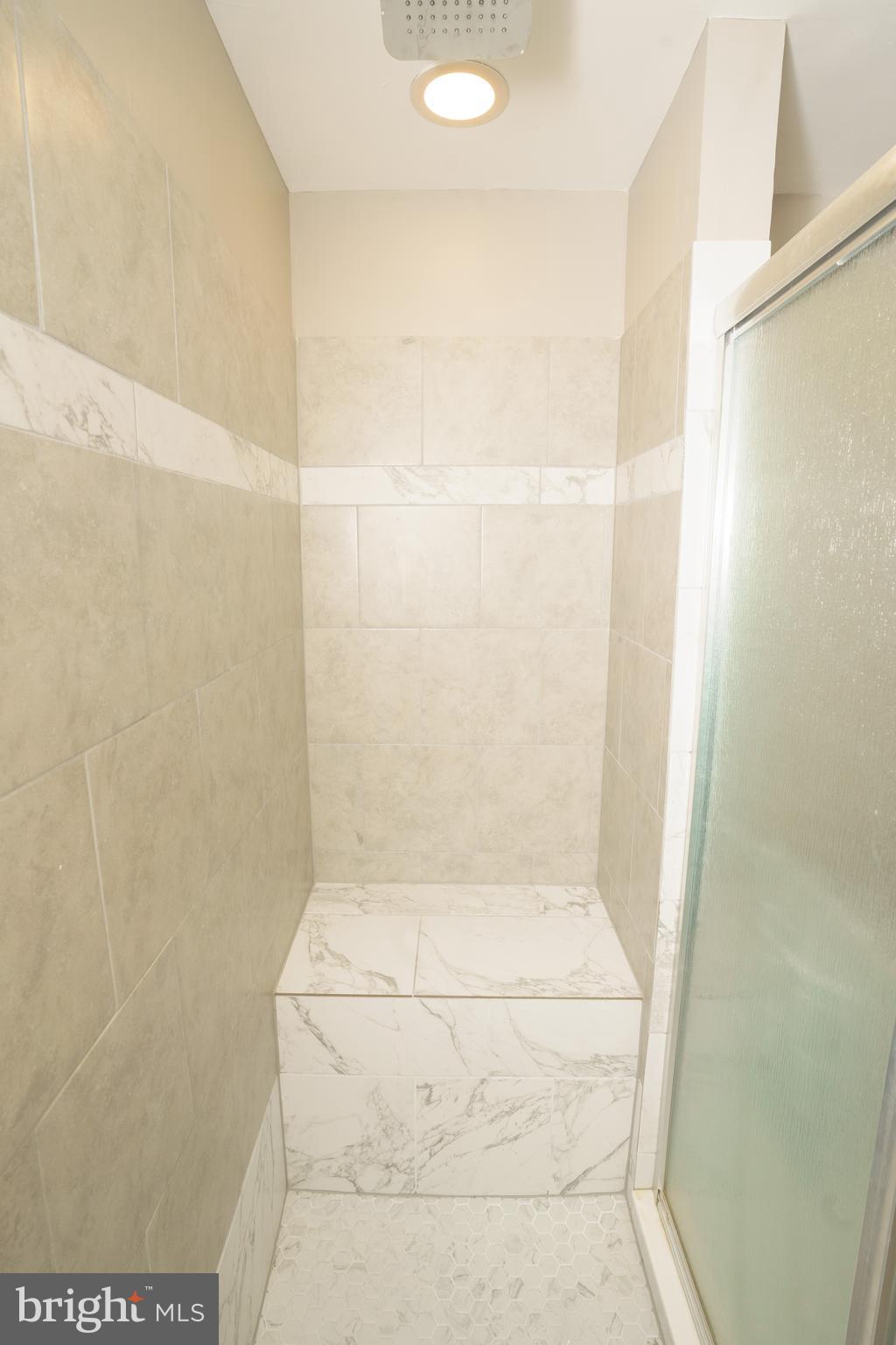 907 Reece Road Severn, MD 21144 - Photo 27 of 56 a bathroom with a shower