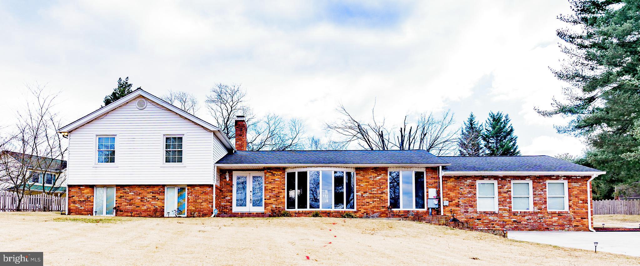 907 Reece Road Severn, MD 21144 - Photo 3 of 56 front view of a house with a street