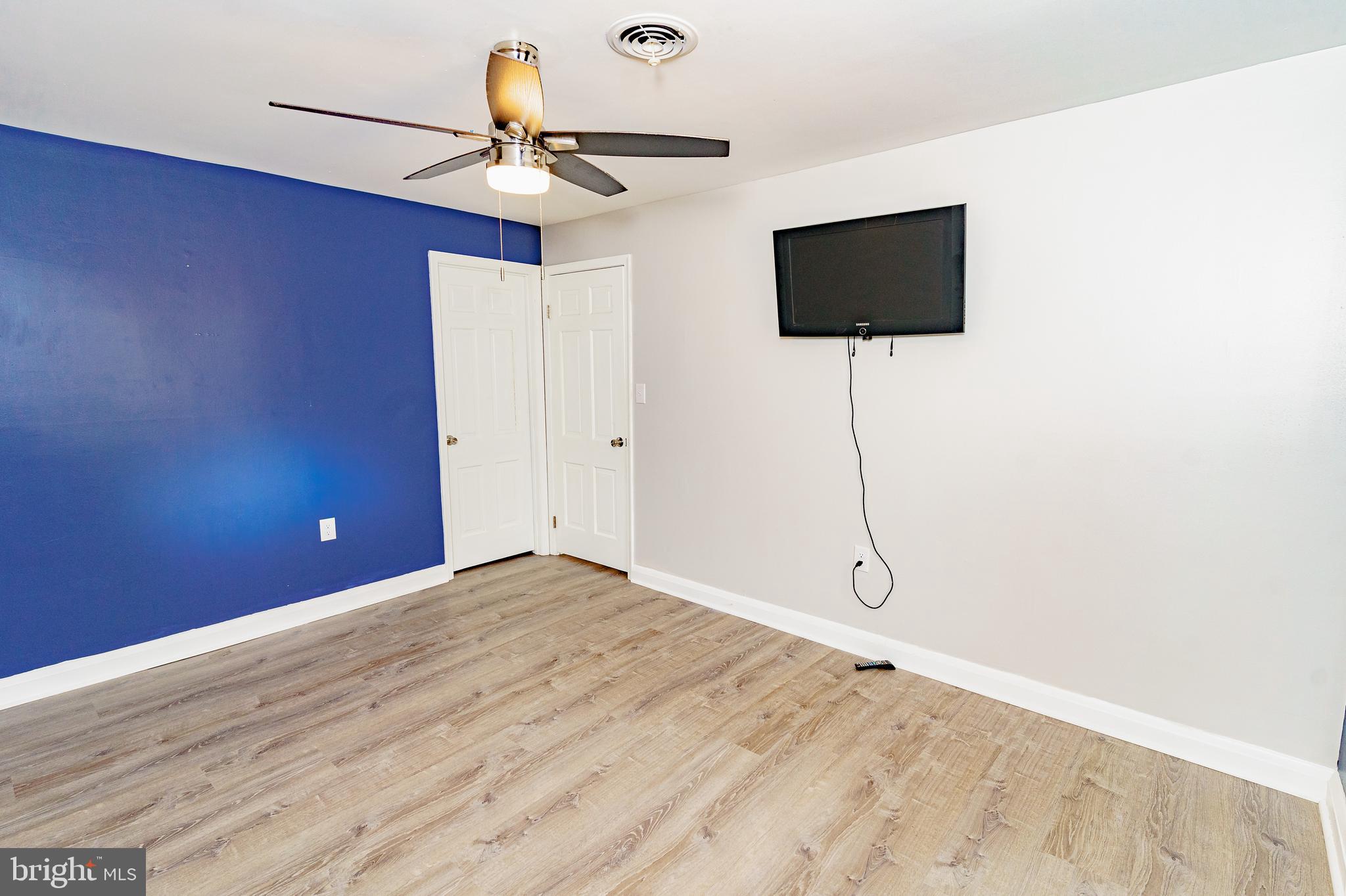 907 Reece Road Severn, MD 21144 - Photo 34 of 56 a view of a livingroom with a flat screen tv