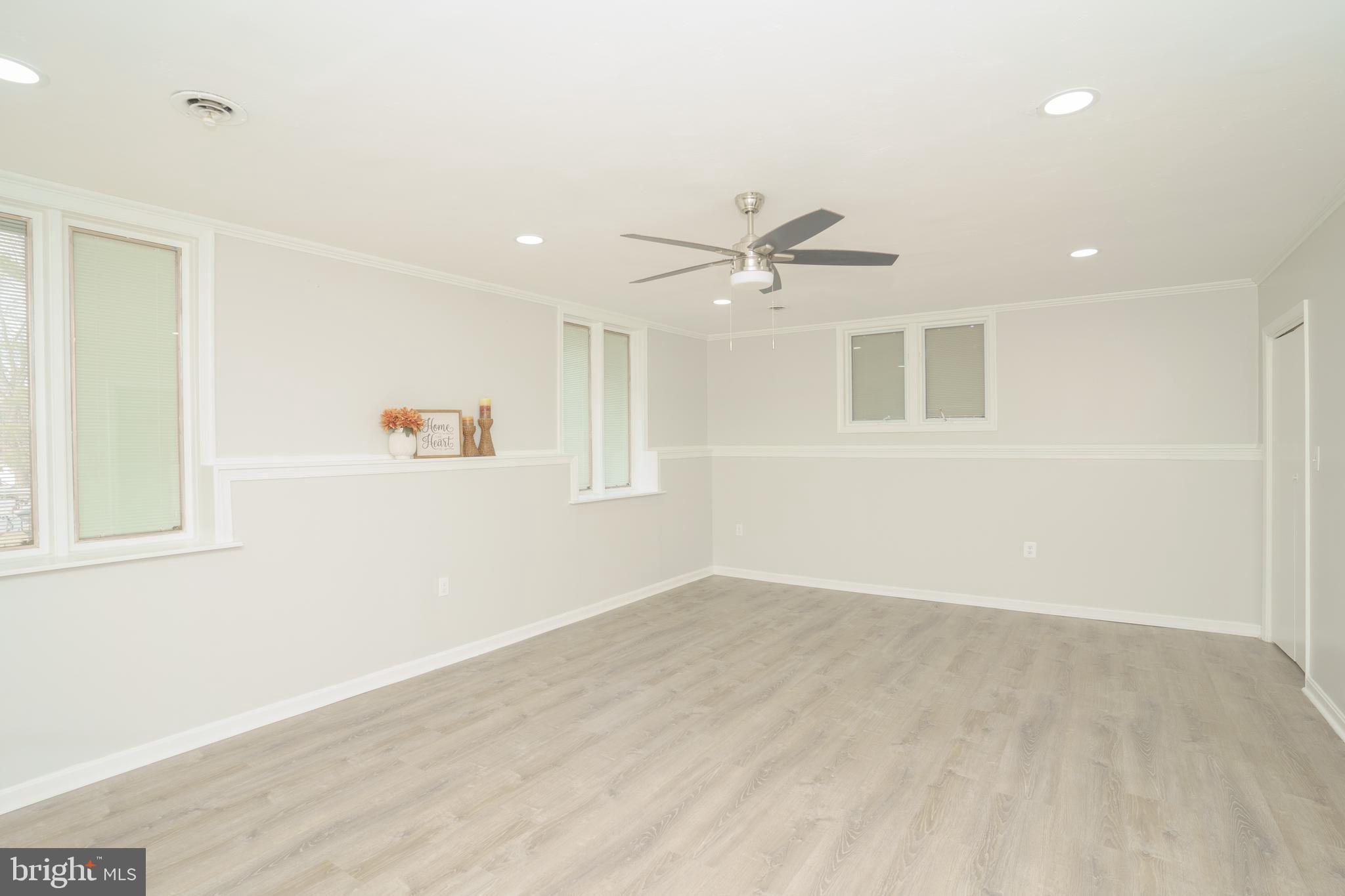 907 Reece Road Severn, MD 21144 - Photo 35 of 56 a view of an empty room with a window
