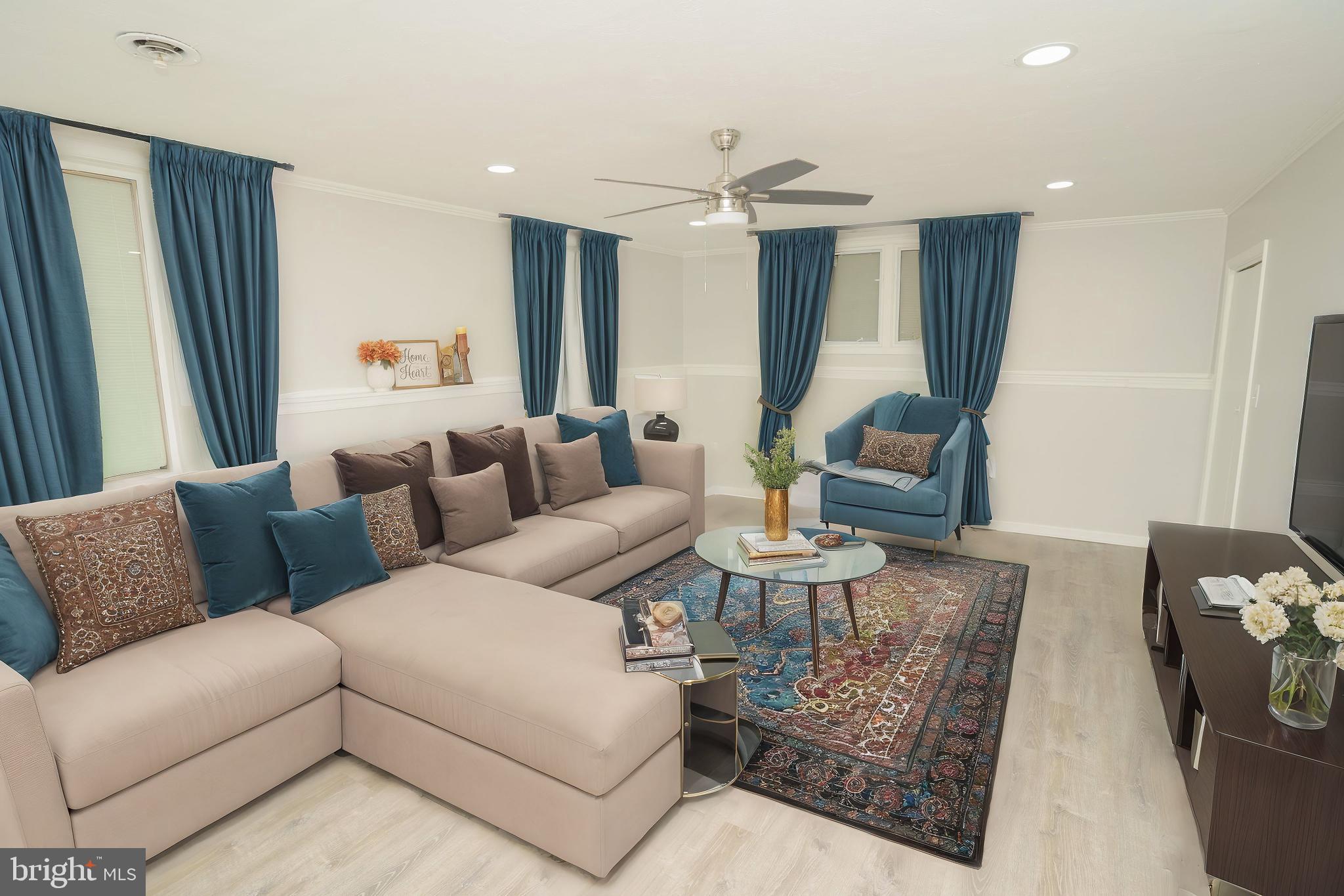 907 Reece Road Severn, MD 21144 - Photo 36 of 56 a living room with furniture kitchen view and a large window