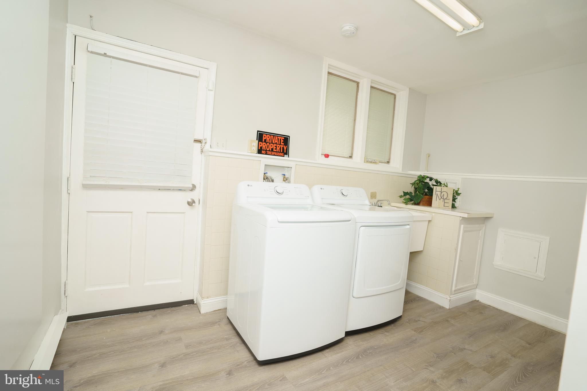 907 Reece Road Severn, MD 21144 - Photo 41 of 56 a utility room with dryer and washer