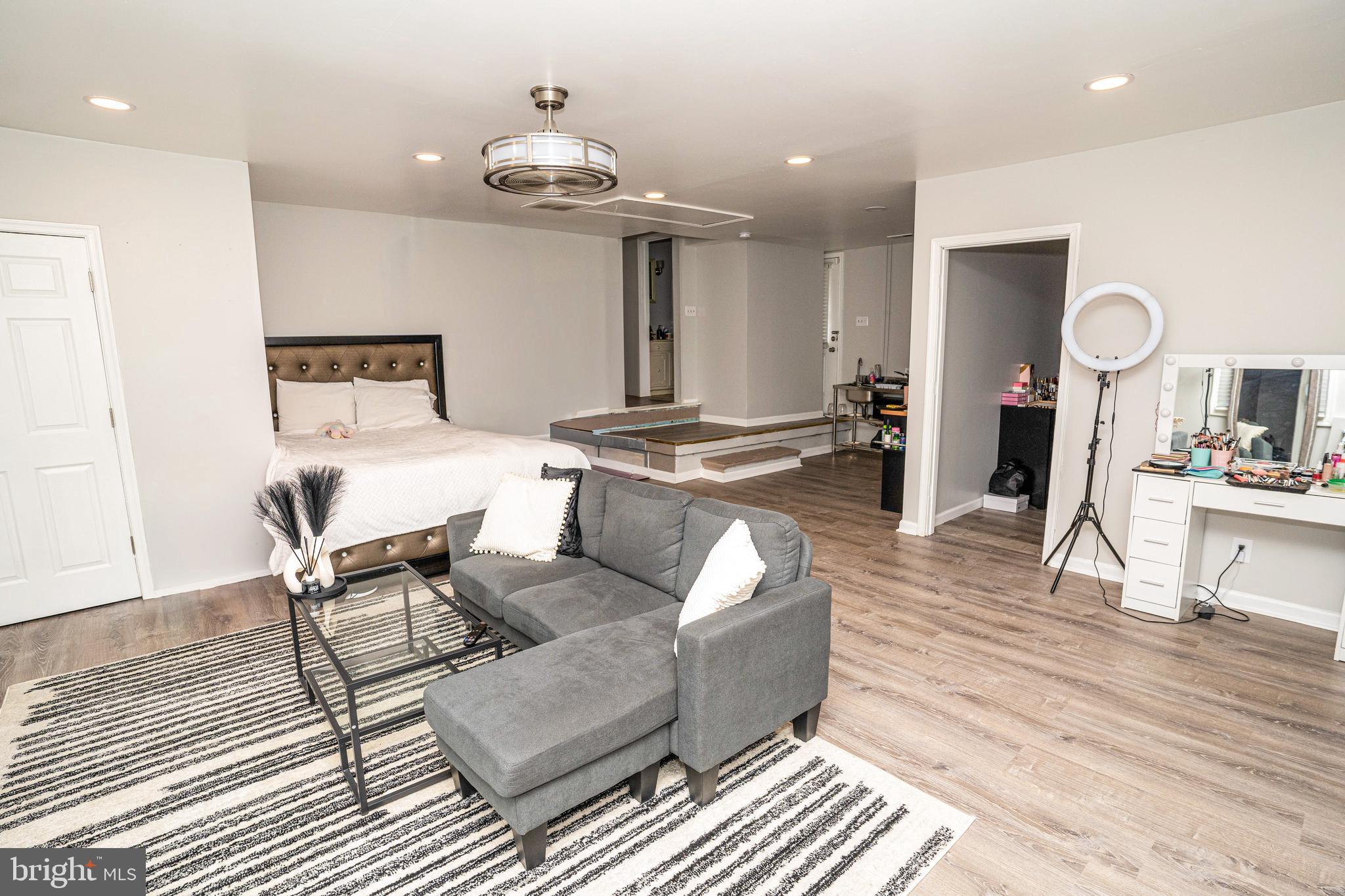 907 Reece Road Severn, MD 21144 - Photo 43 of 56 a living room with furniture and a chandelier