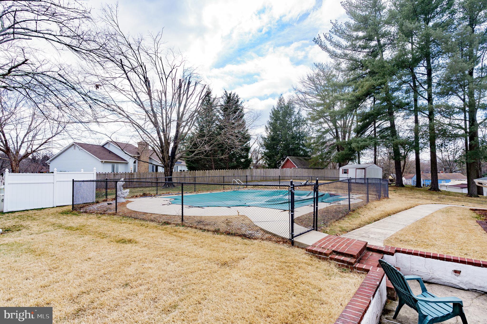 907 Reece Road Severn, MD 21144 - Photo 46 of 56 a view of swimming pool with trees