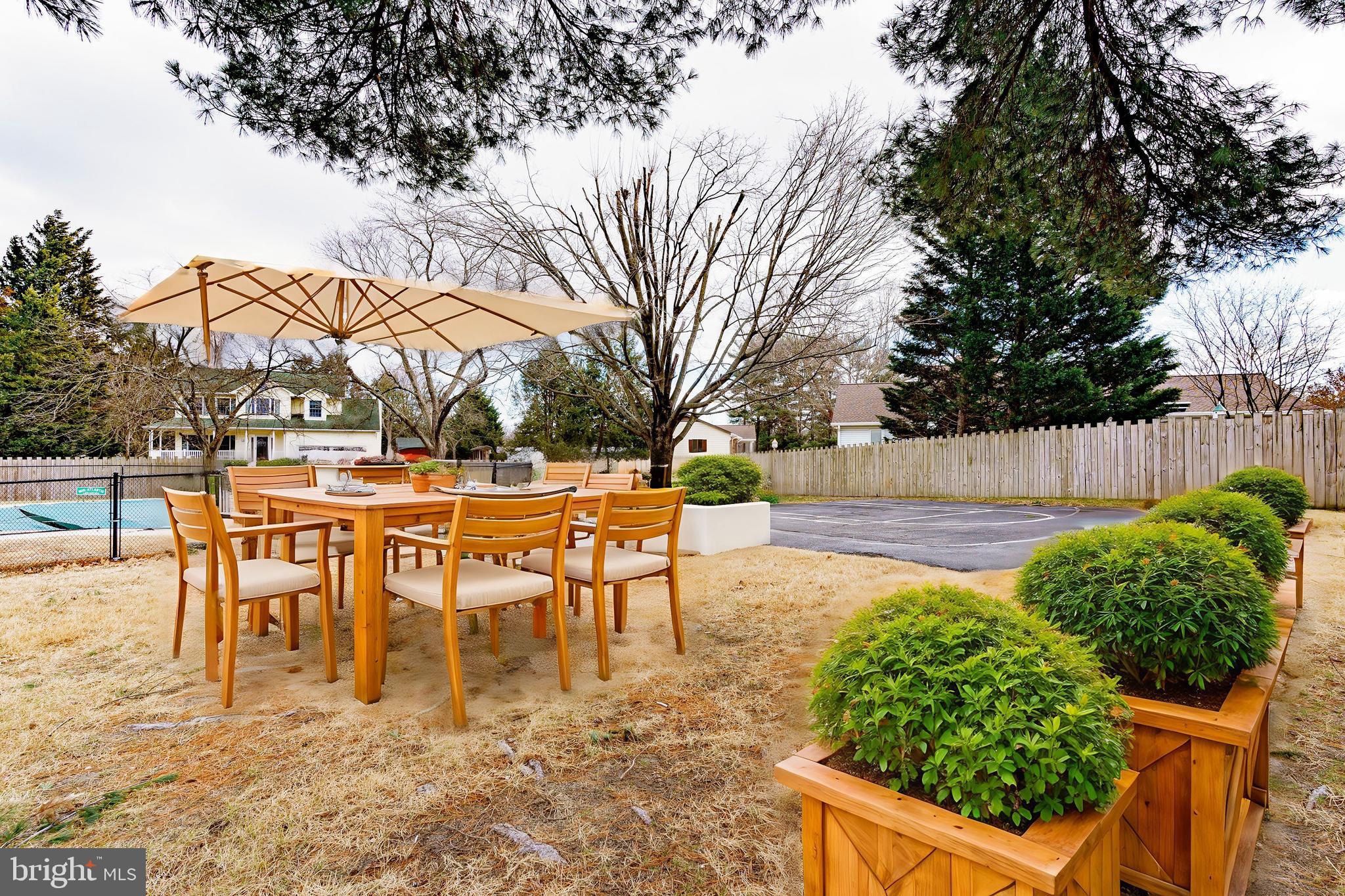 907 Reece Road Severn, MD 21144 - Photo 49 of 56 a view of a chairs and table in the patio