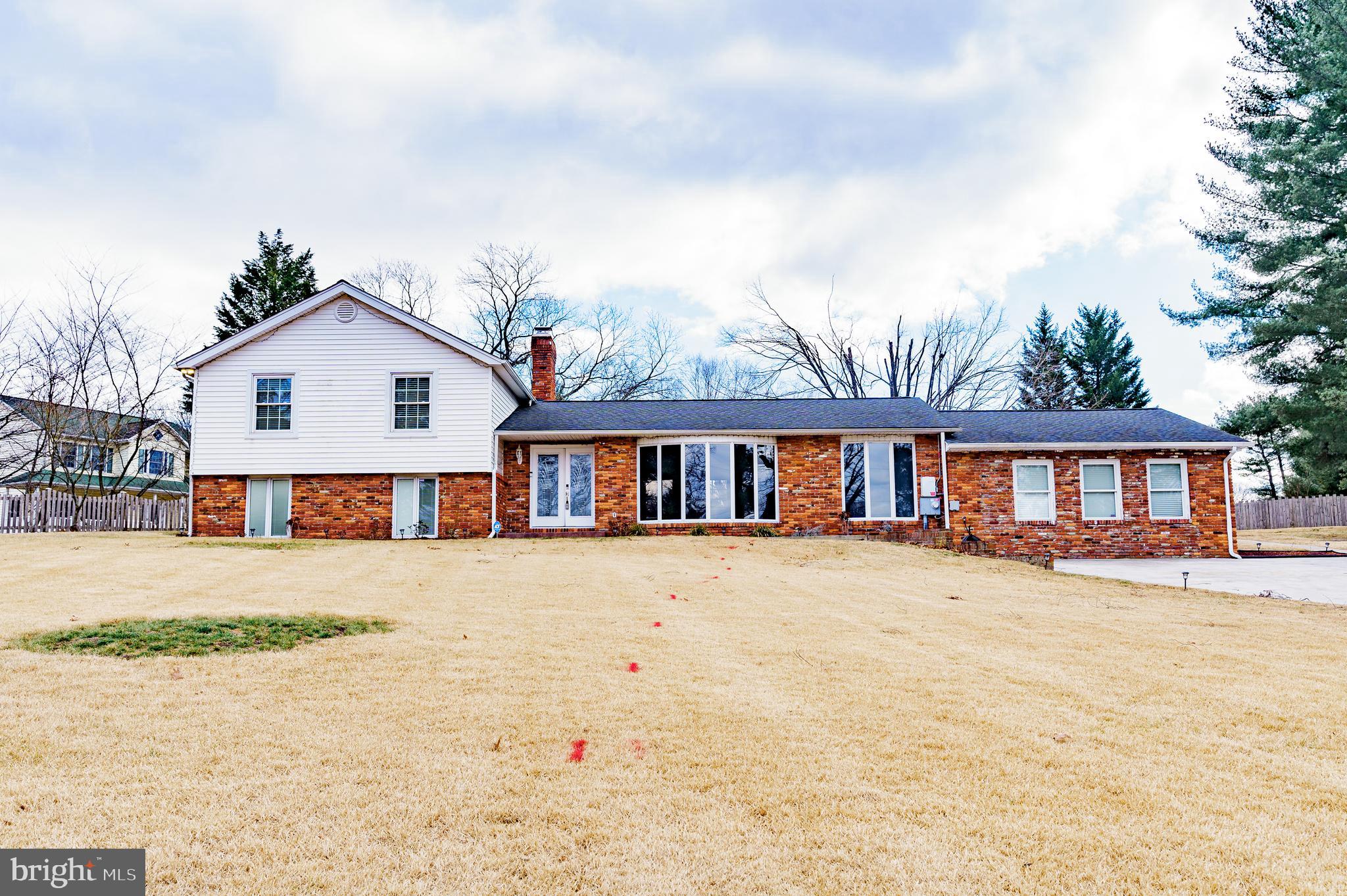 907 Reece Road Severn, MD 21144 - Photo 53 of 56 a front view of a house with a yard and garage