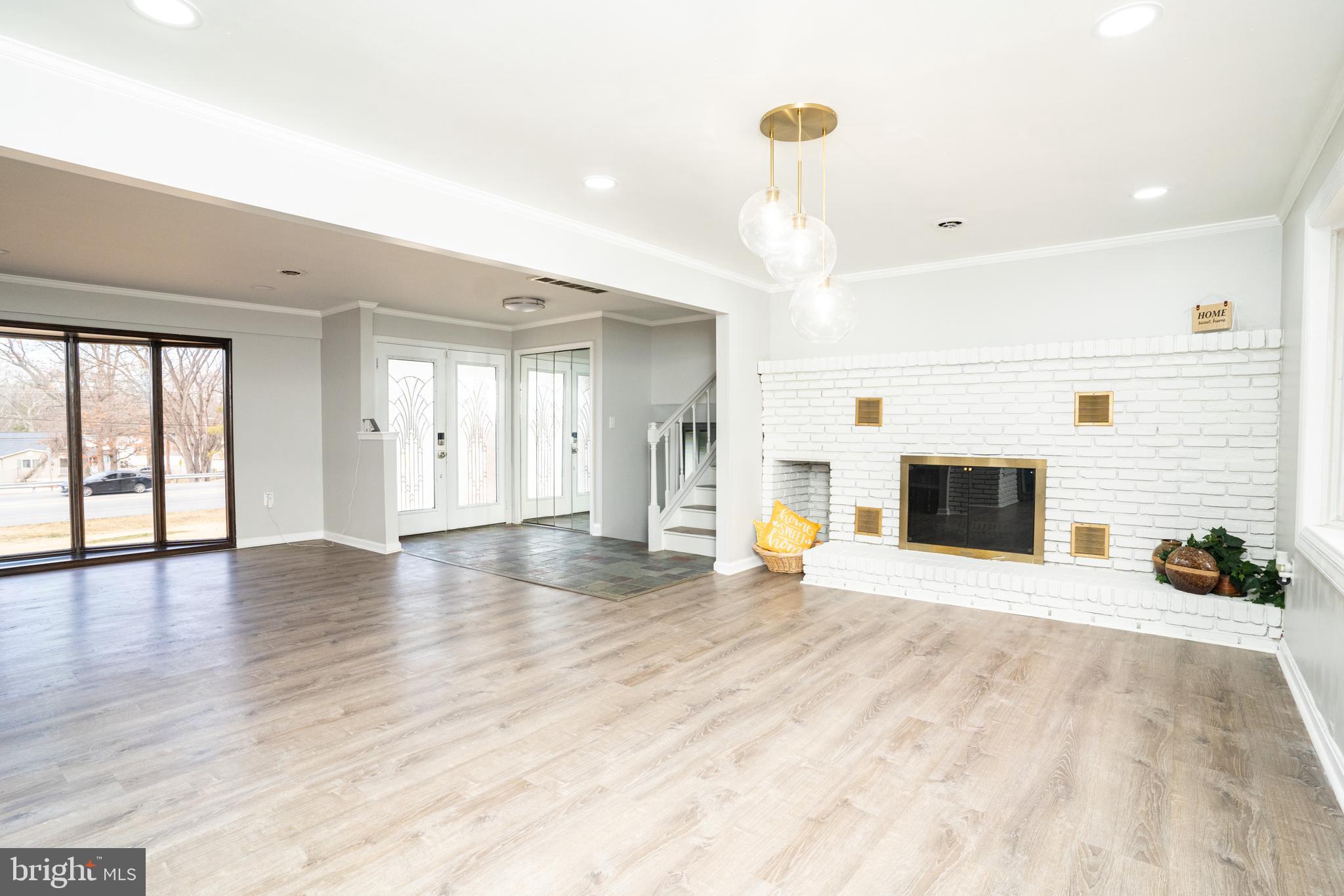 907 Reece Road Severn, MD 21144 - Photo 10 of 56 a view of a livingroom with fireplace and window