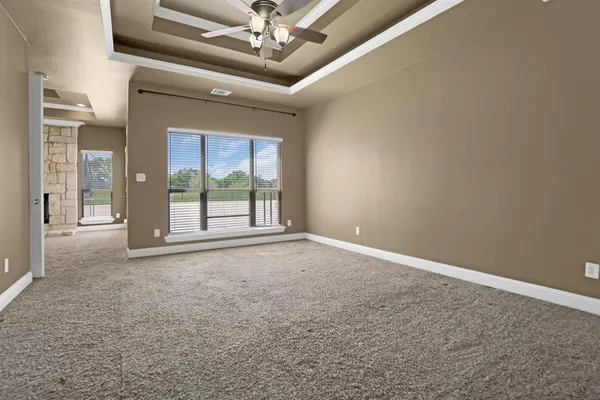 a view of an empty room with a window