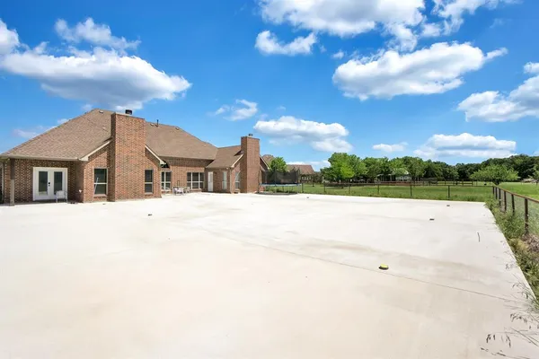 a view of house with yard