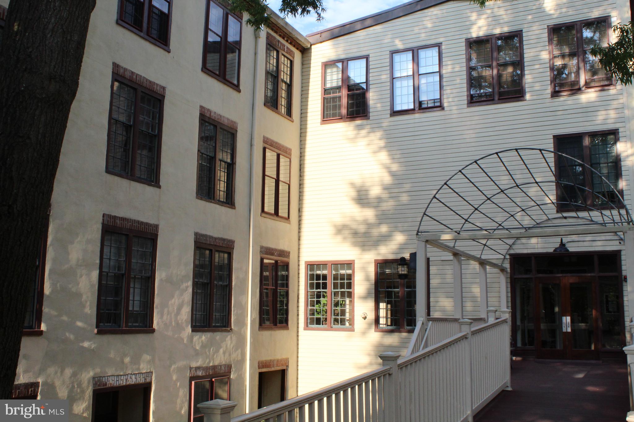 49 Bancroft Mills Road, Unit 3J Wilmington, DE 19806 - Photo 1 of 25 a view of a building with a outdoor space
