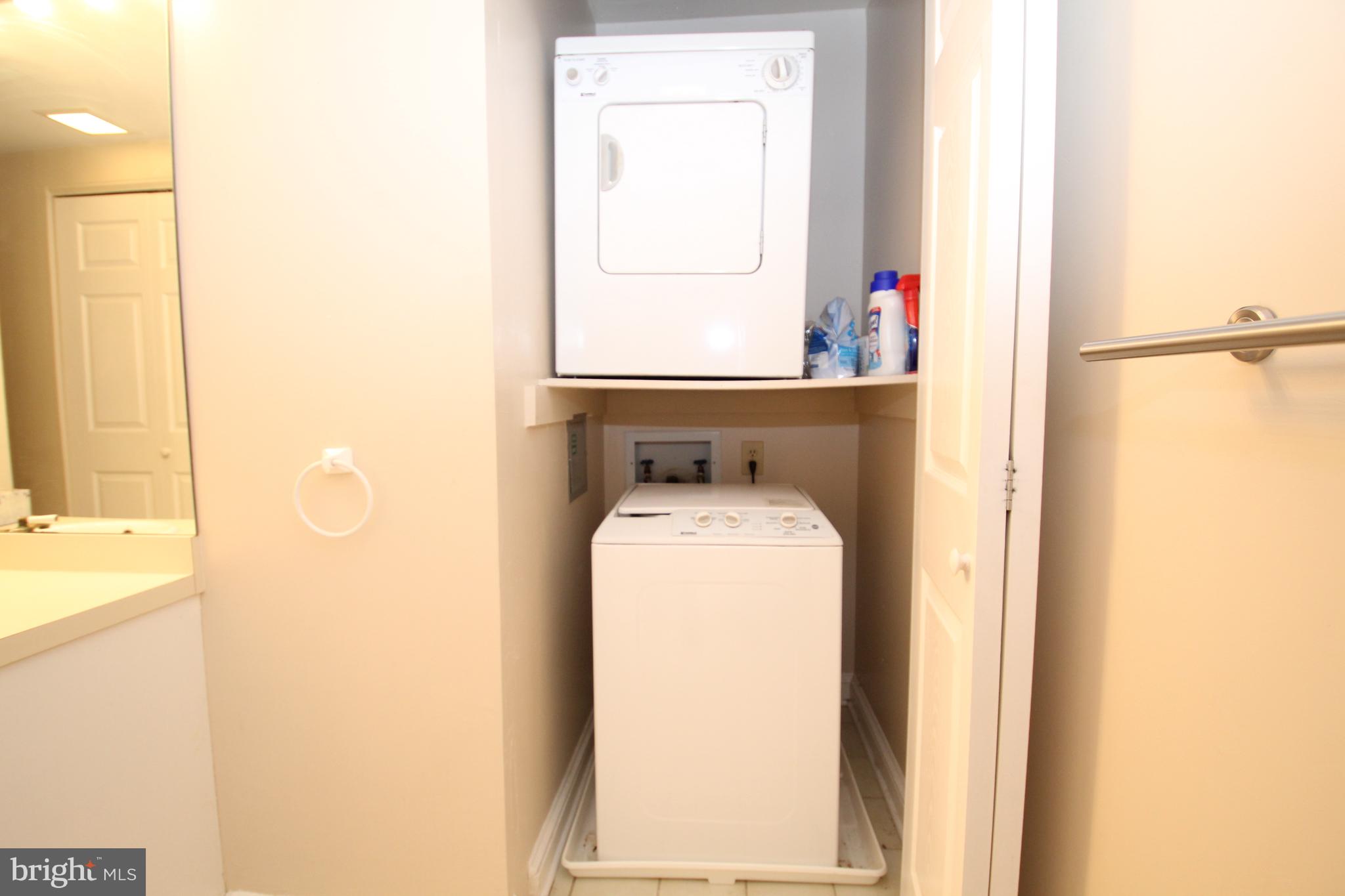 49 Bancroft Mills Road, Unit 3J Wilmington, DE 19806 - Photo 19 of 25 a utility room with dryer and washer