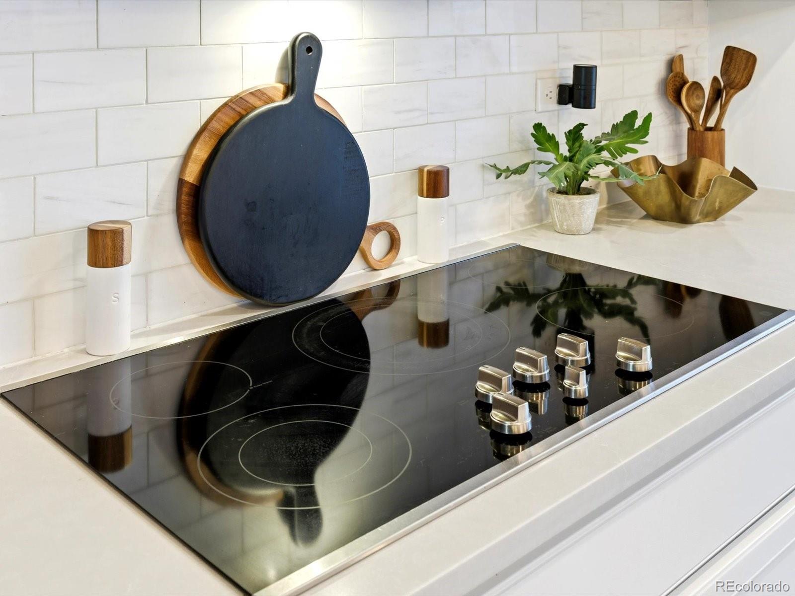 8338 Rivulet Point Highlands Ranch, CO 80129 - Photo 16 of 50 a close view of sink and a stove