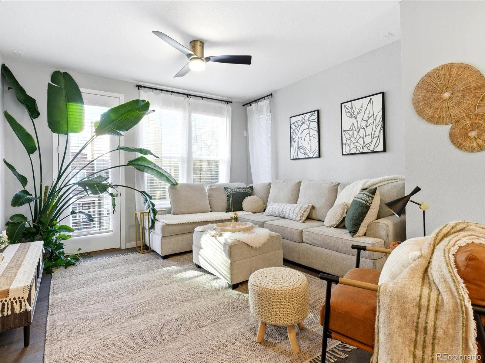 8338 Rivulet Point Highlands Ranch, CO 80129 - Photo 18 of 50 a living room with furniture flowerpot and window
