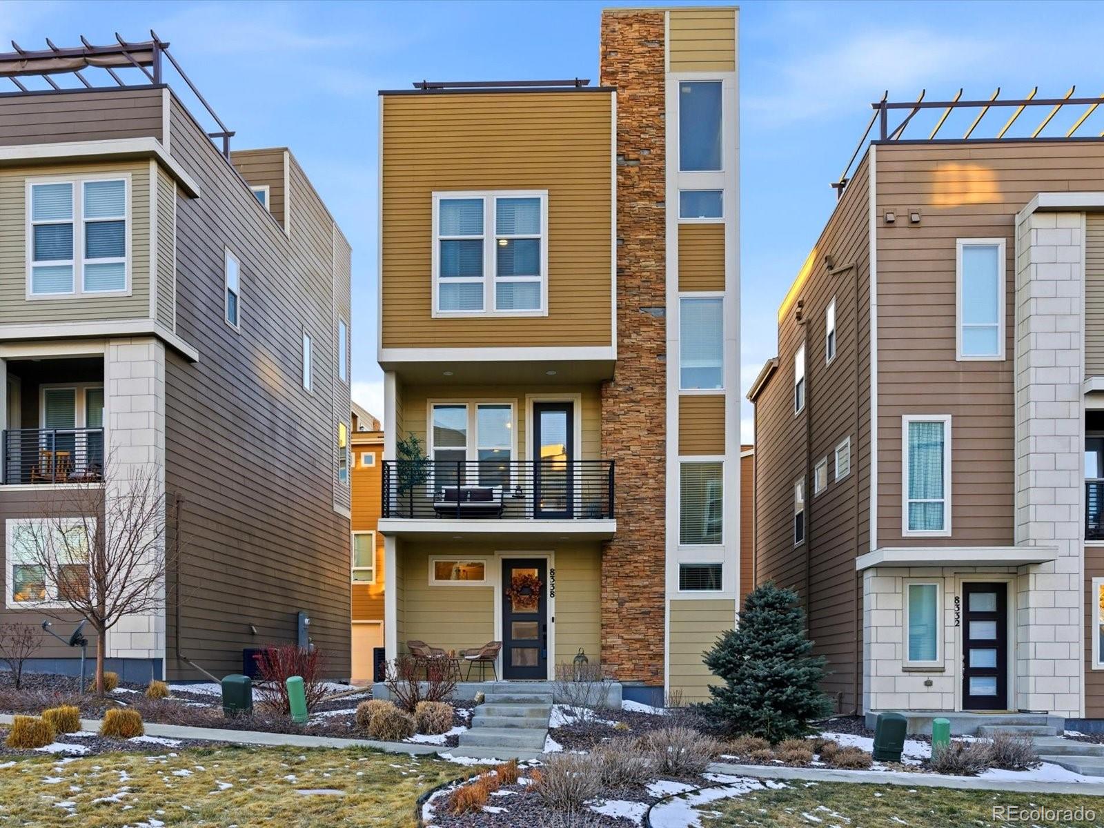 8338 Rivulet Point Highlands Ranch, CO 80129 - Photo 2 of 50 a view of a building with a yard