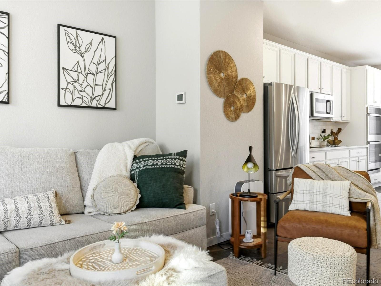 8338 Rivulet Point Highlands Ranch, CO 80129 - Photo 21 of 50 a living room with furniture and a large window