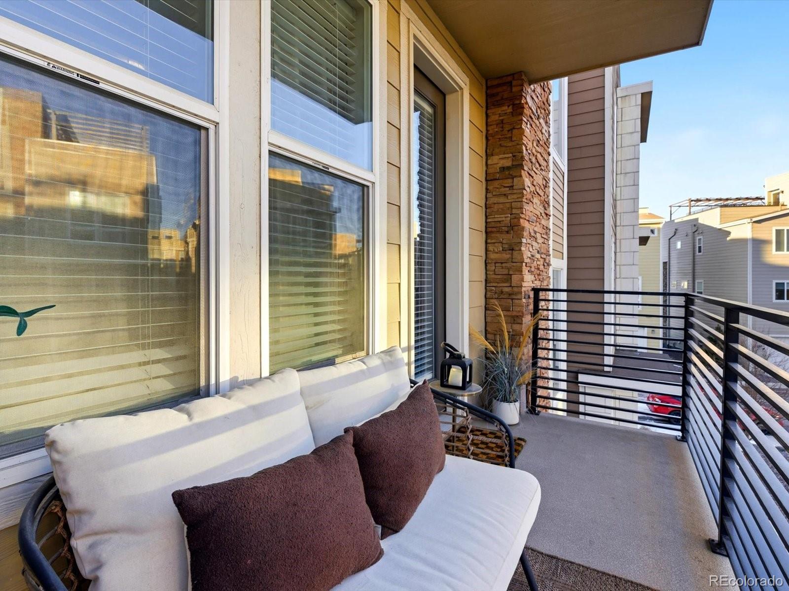 8338 Rivulet Point Highlands Ranch, CO 80129 - Photo 24 of 50 a balcony with furniture and a window