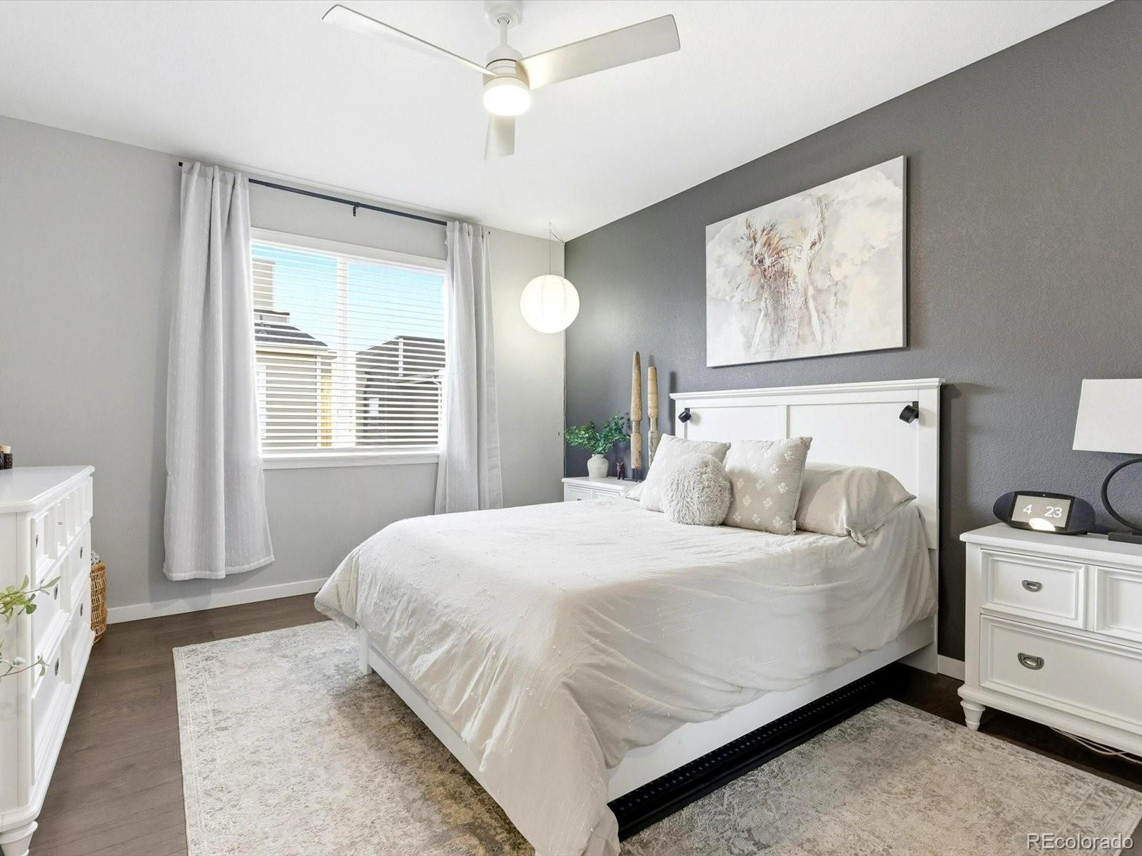 8338 Rivulet Point Highlands Ranch, CO 80129 - Photo 30 of 50 a bedroom with a large bed and a window