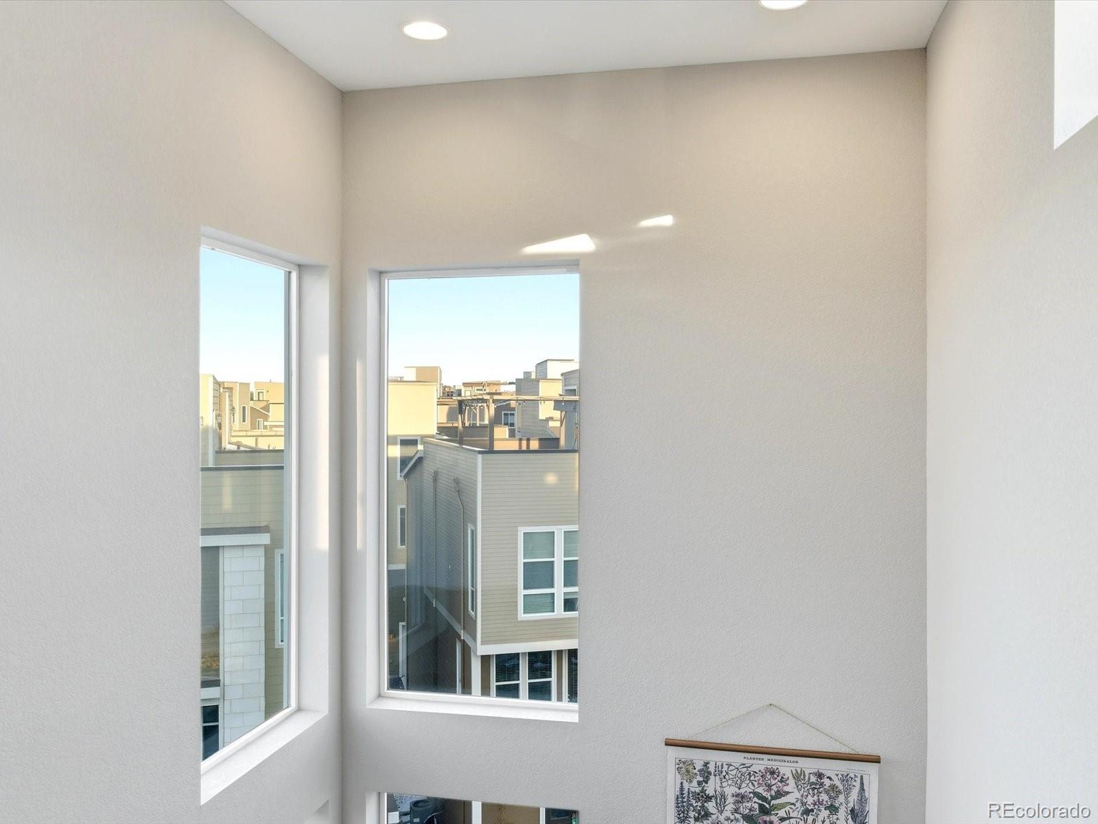 8338 Rivulet Point Highlands Ranch, CO 80129 - Photo 38 of 50 a view of a hallway with windows