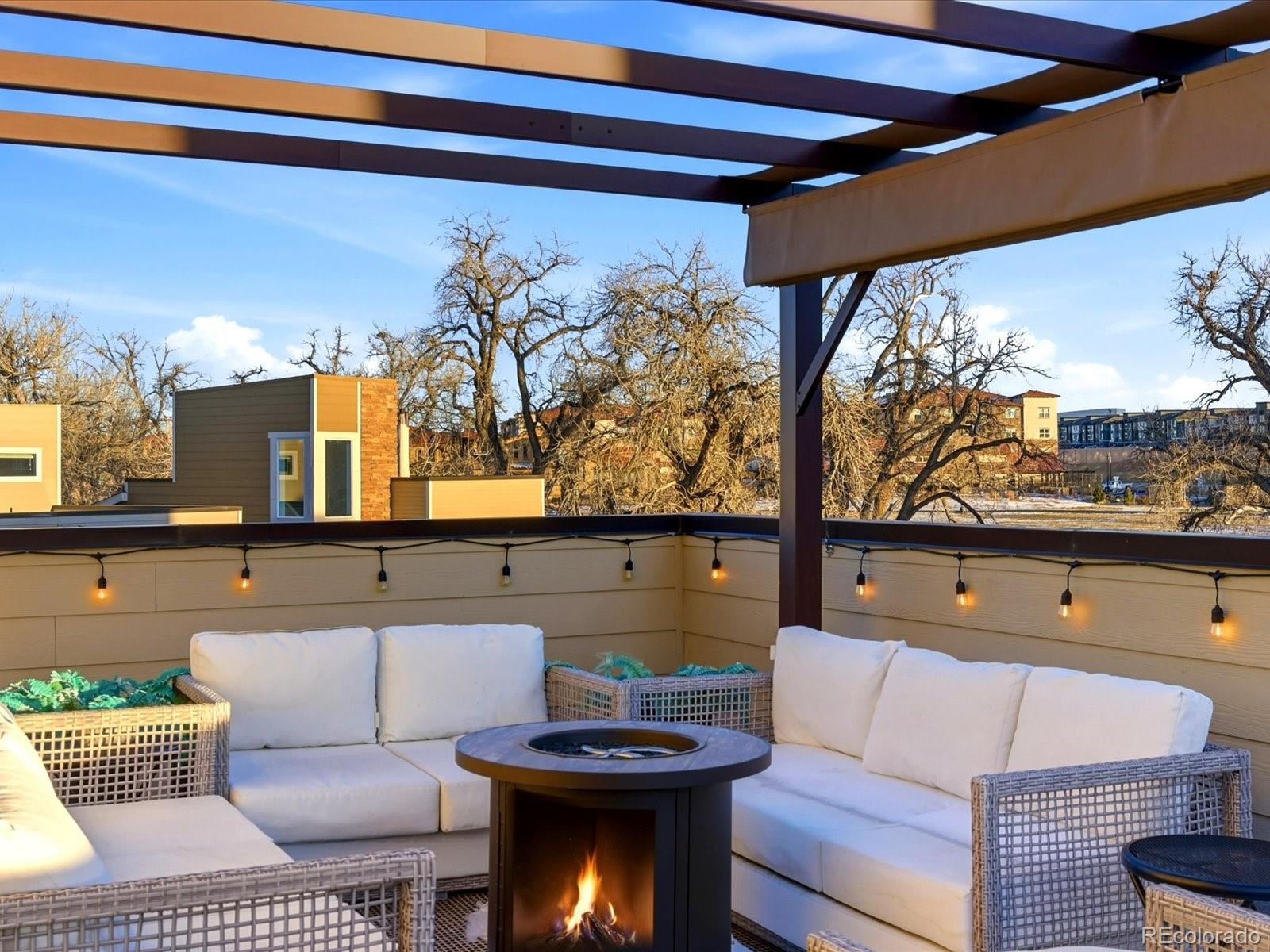 8338 Rivulet Point Highlands Ranch, CO 80129 - Photo 39 of 50 a living room with large couches and painted walls with a flat screen tv
