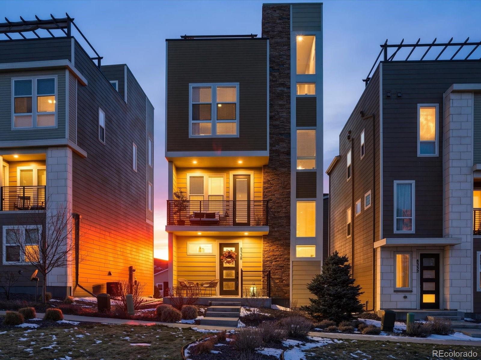 8338 Rivulet Point Highlands Ranch, CO 80129 - Photo 4 of 50 a city street lined with tall buildings