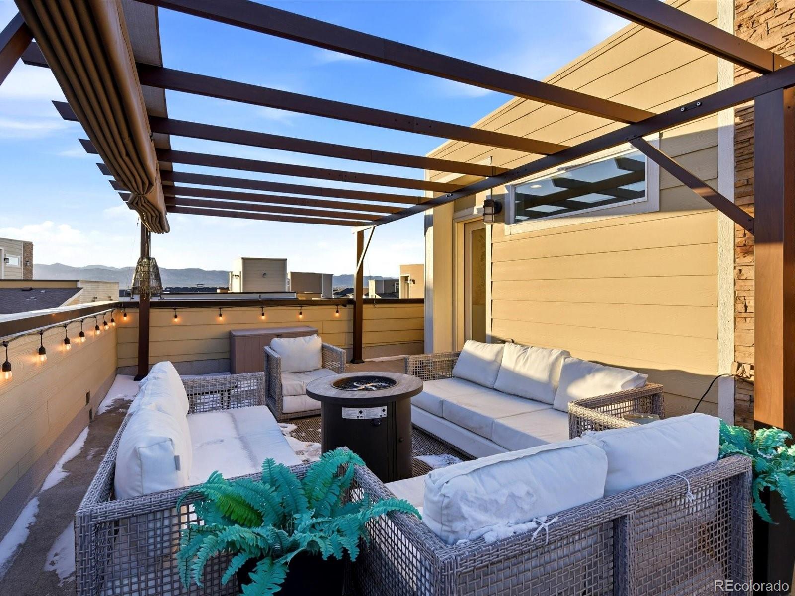 8338 Rivulet Point Highlands Ranch, CO 80129 - Photo 41 of 50 a patio with patio a couch and chairs