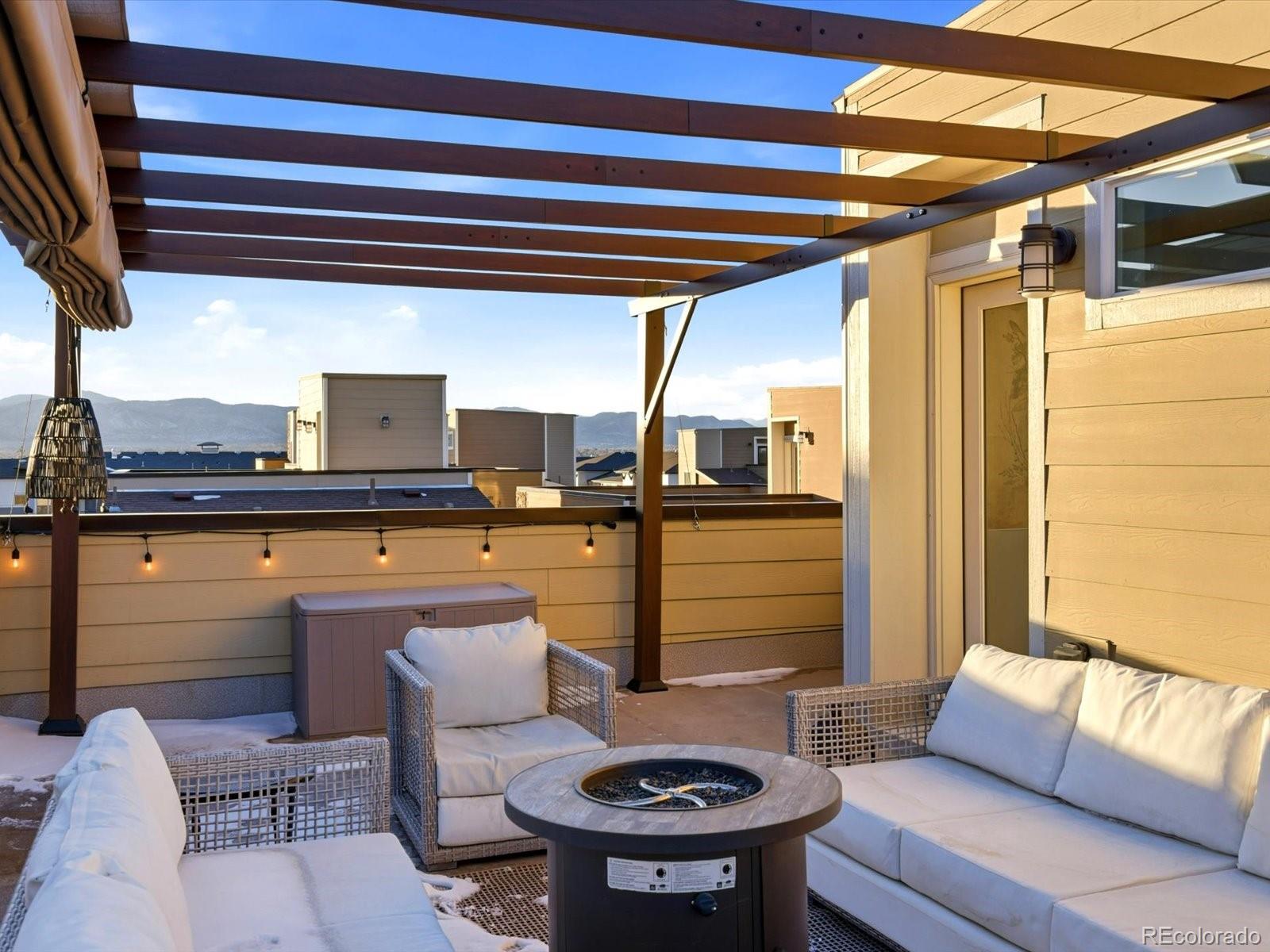 8338 Rivulet Point Highlands Ranch, CO 80129 - Photo 42 of 50 a kitchen view with a sink and chairs
