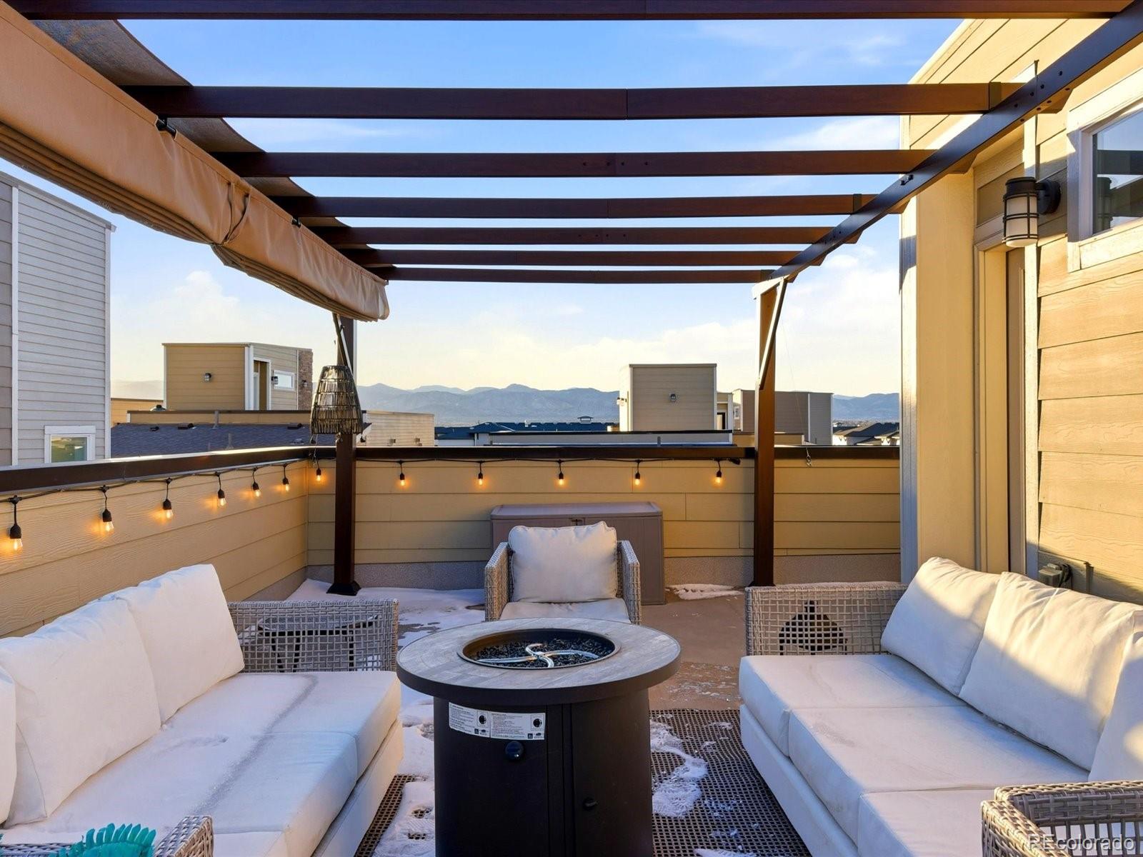 8338 Rivulet Point Highlands Ranch, CO 80129 - Photo 44 of 50 a living room with furniture and a floor to ceiling window
