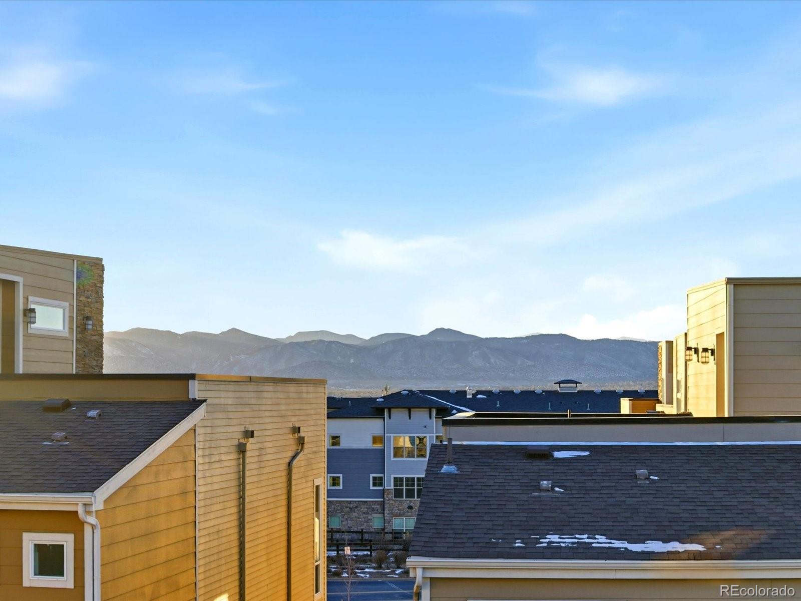 8338 Rivulet Point Highlands Ranch, CO 80129 - Photo 45 of 50 a view of balcony with two chairs and a table