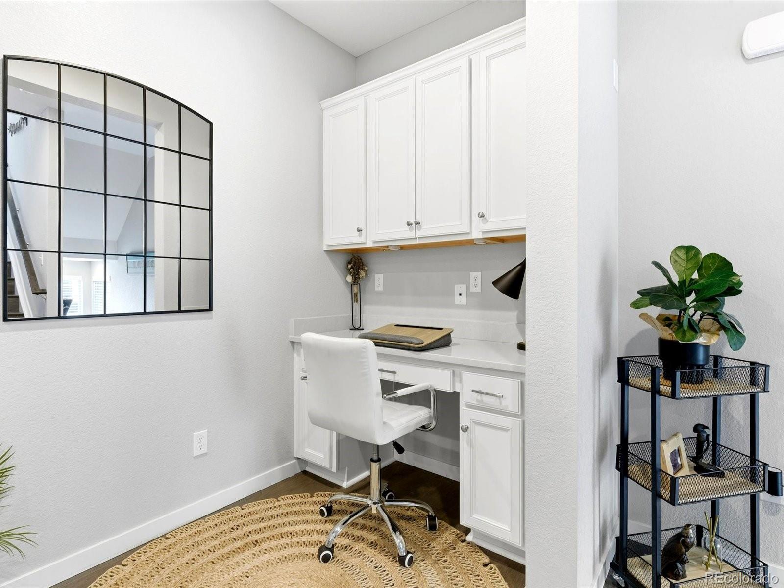 8338 Rivulet Point Highlands Ranch, CO 80129 - Photo 10 of 50 a view of a workspace with furniture and a window