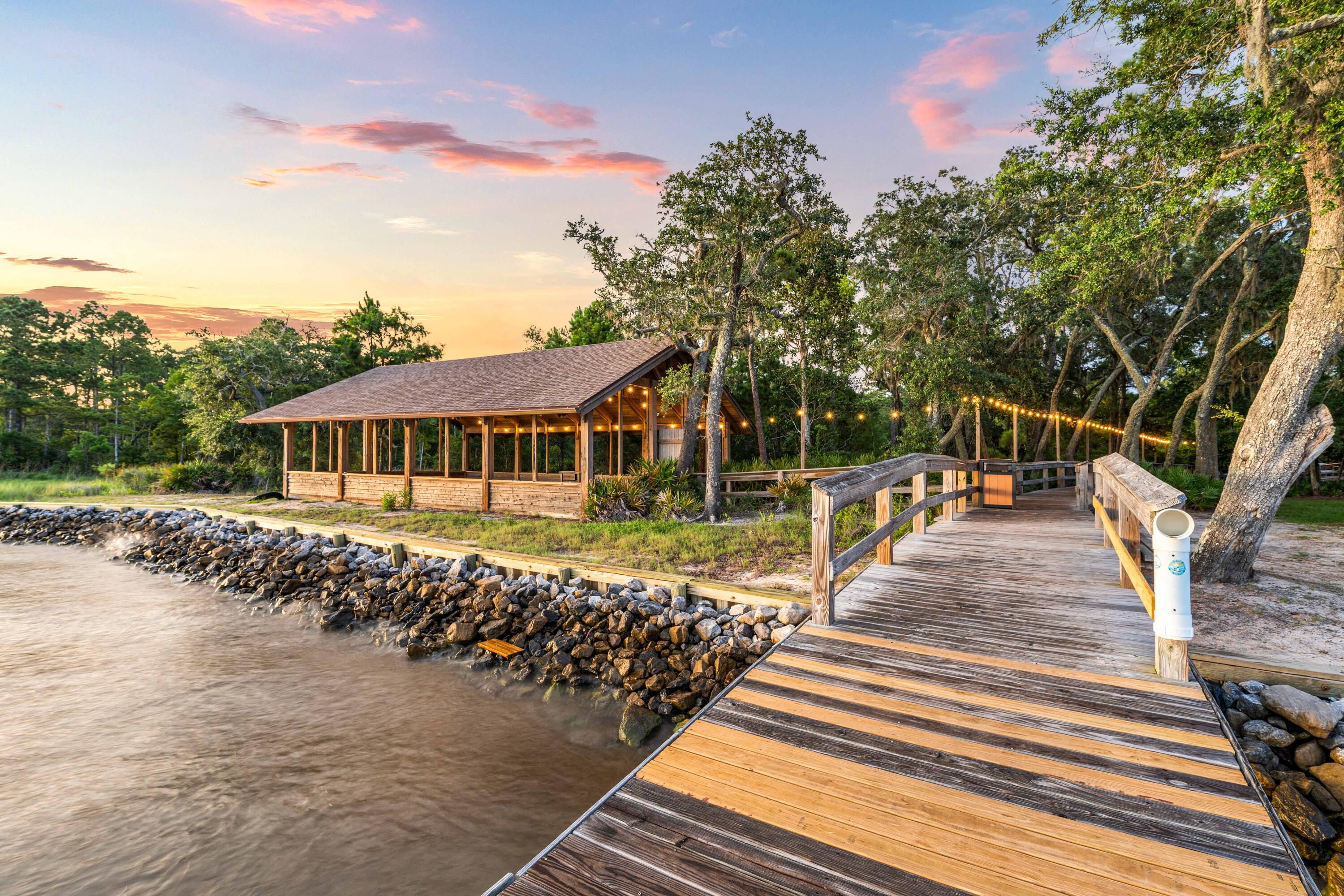 112 East Captain Fritz Way Freeport, FL 32439 - Photo 19 of 58 a front view of a house with a yard