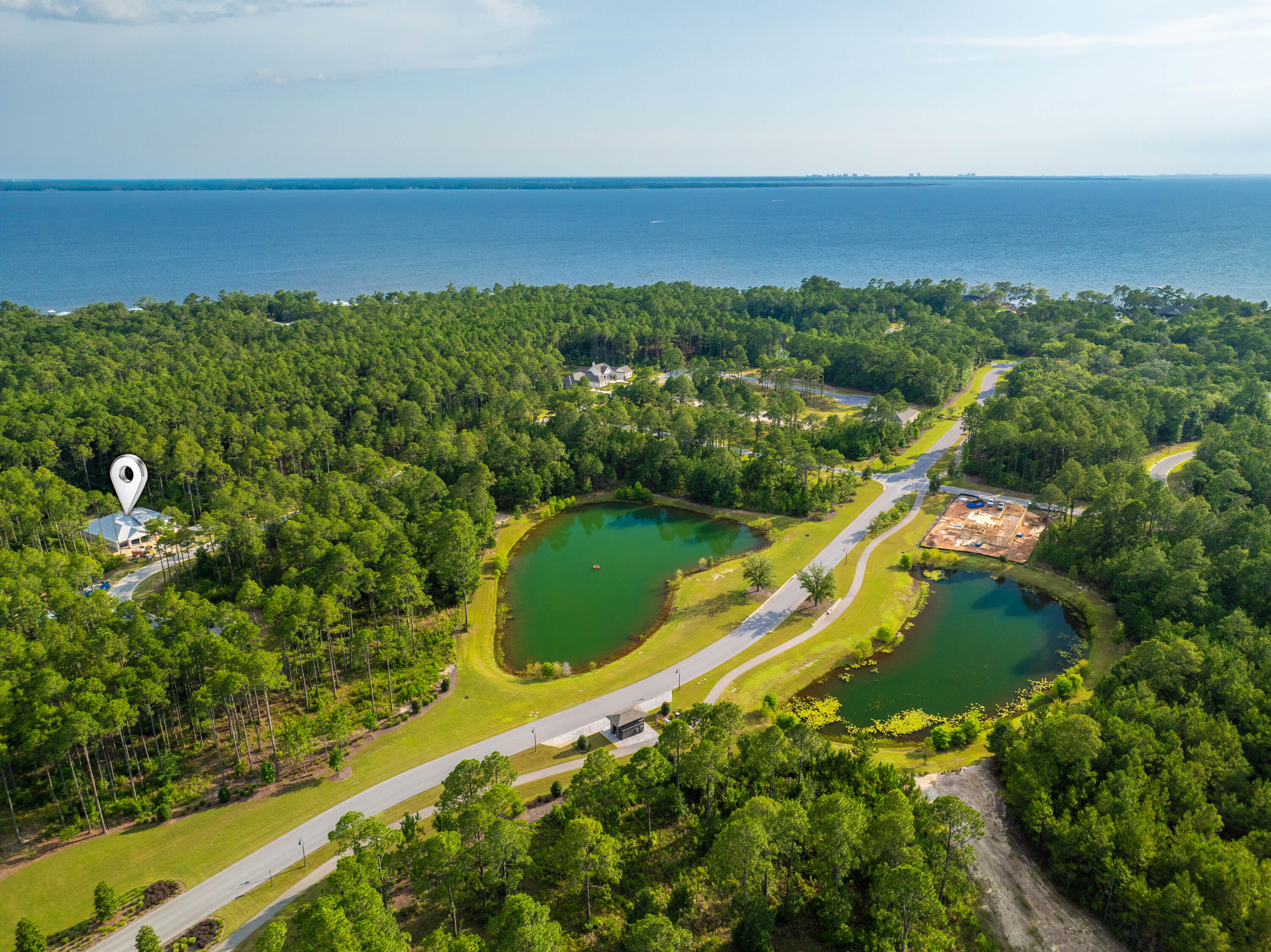 112 East Captain Fritz Way Freeport, FL 32439 - Photo 6 of 58 a view of a large body of water with a building in the background
