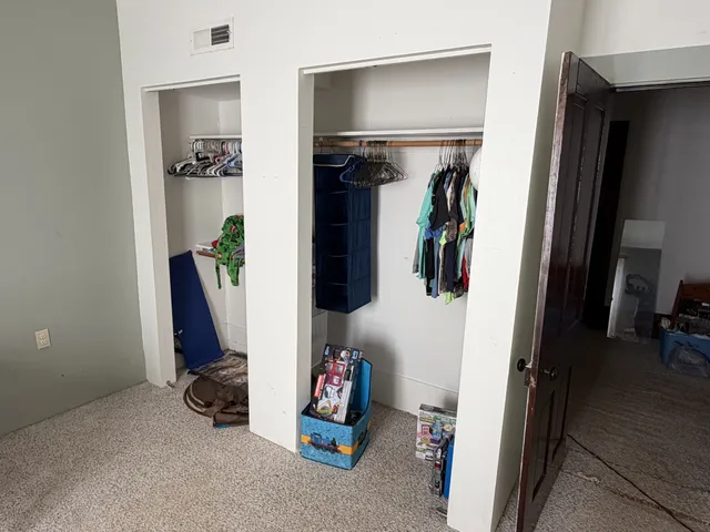 a bedroom with furniture and a window