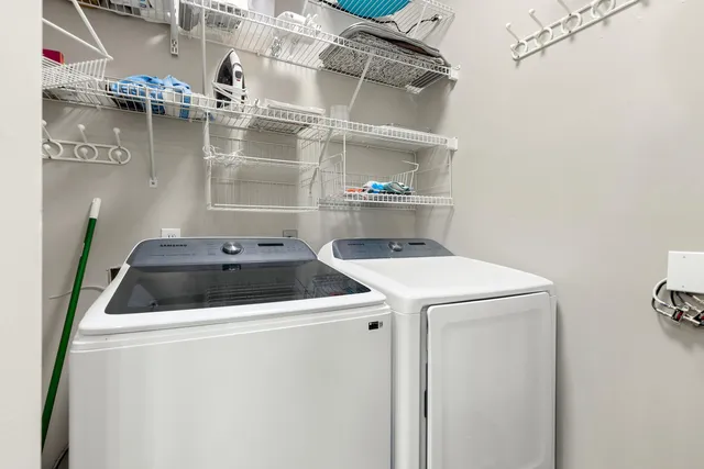 a bathroom with a granite countertop sink a toilet a shower and a mirror