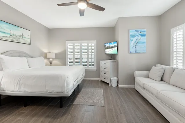 a bed room with a bed and a chandelier