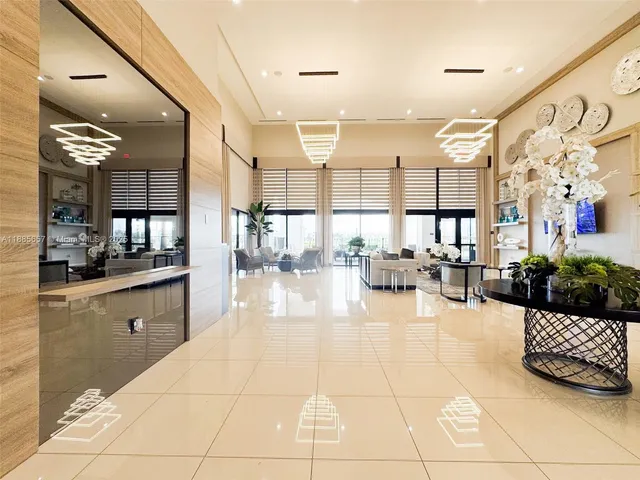 a kitchen with stainless steel appliances kitchen island granite countertop a sink and cabinets