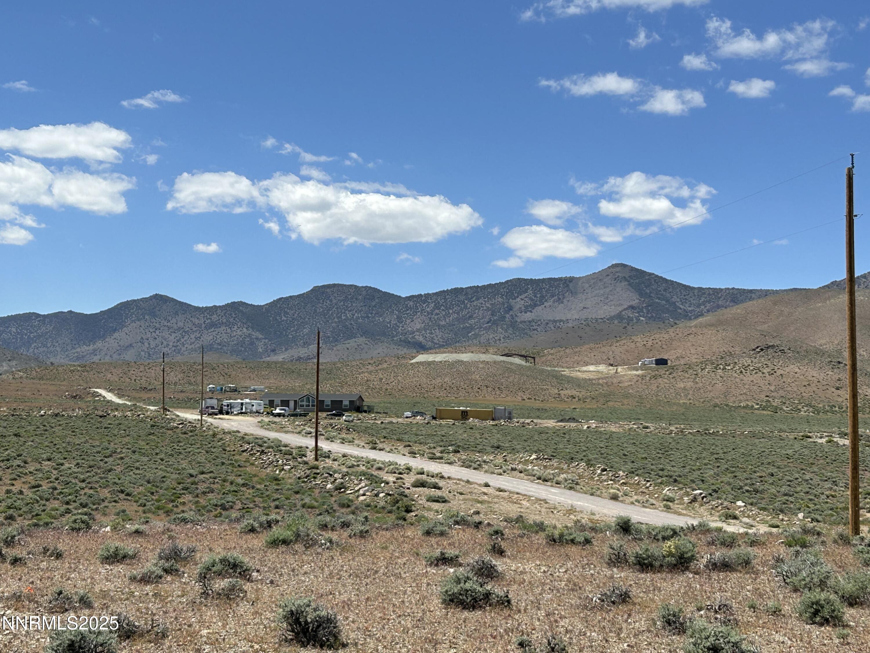13595 Seneca Road Stagecoach, NV 89429 - Photo 7 of 15 a view of a town with mountains in the background