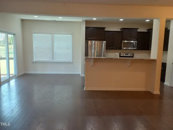a kitchen with a refrigerator sink and microwave