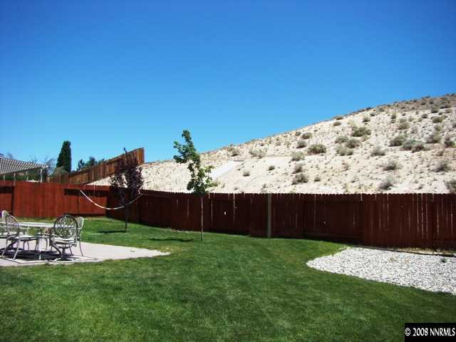 1500 Rainbow Ridge Road Reno, NV 89523 - Photo 8 of 9 a front view of a house with a yard