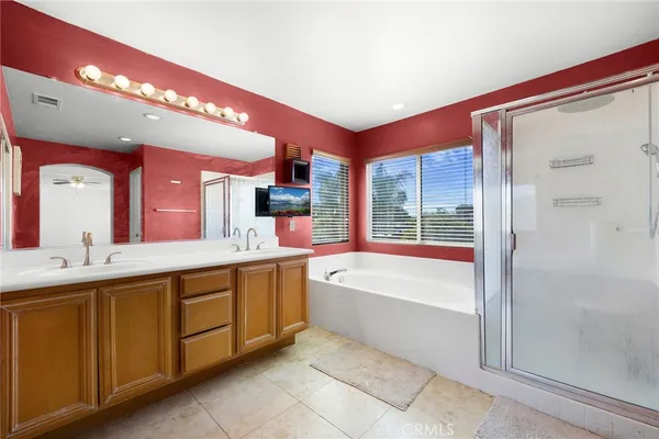 a bathroom with a sink and cabinets
