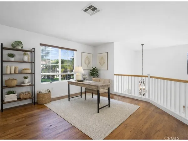 a view of an empty room with stairs