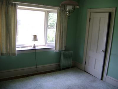 68 Nickerson Road Cotuit, MA 02635 - Photo 11 of 12 an empty room with a window and a closet